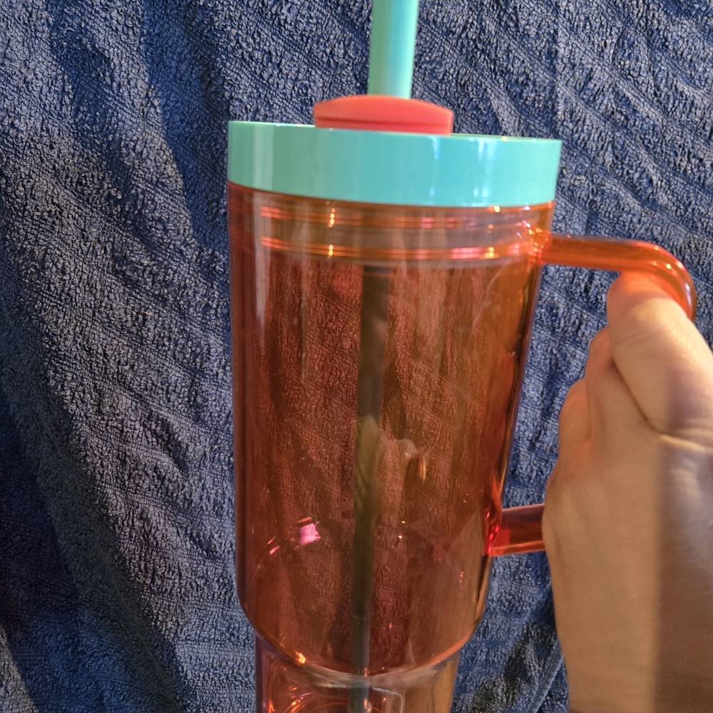 Vibrant Orange Tumbler with Teal Lid and Straw
